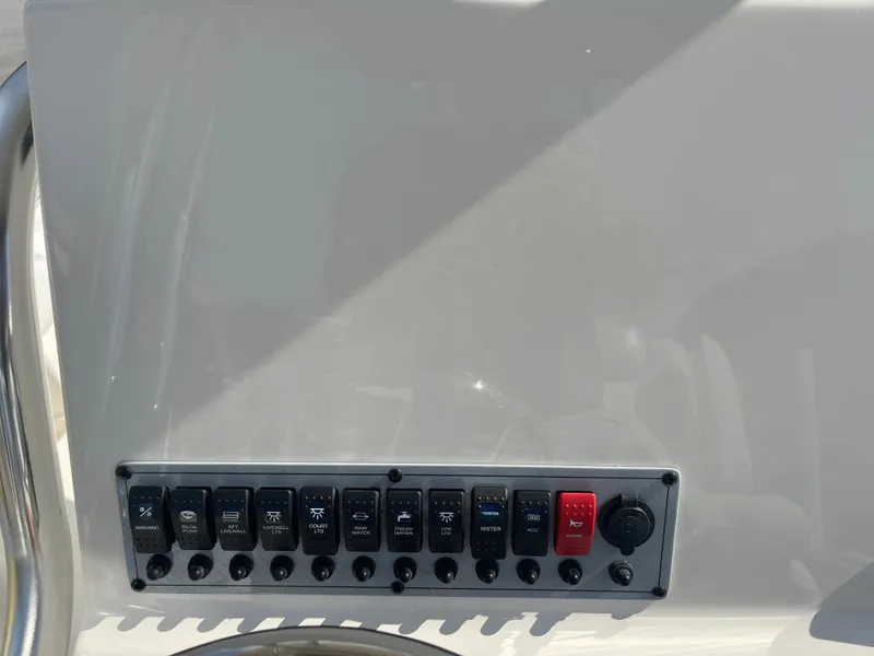 Slide: The Image of Control panel of 2025 Key West 239 FS boat with multiple switches. - 2