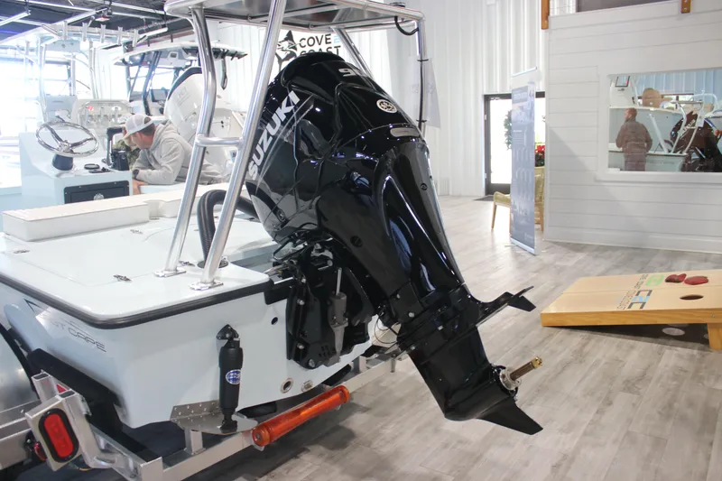 Slide: The Image of 2025 East Cape EVO 18V boat with Suzuki outboard motor in showroom. - 12