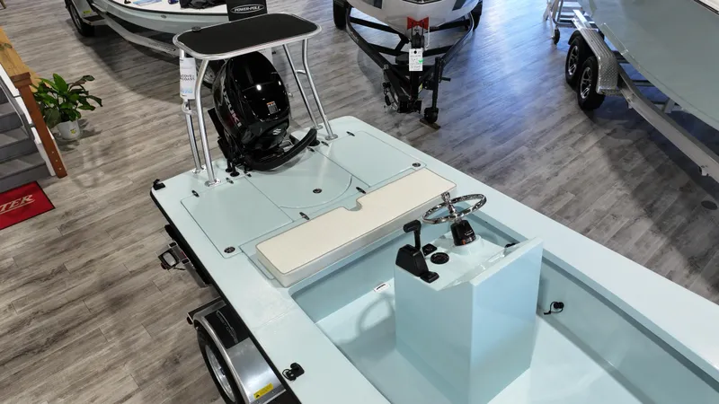 Slide: The Image of 2025 East Cape EVO 18V boat displayed indoors on a wooden floor. - 2