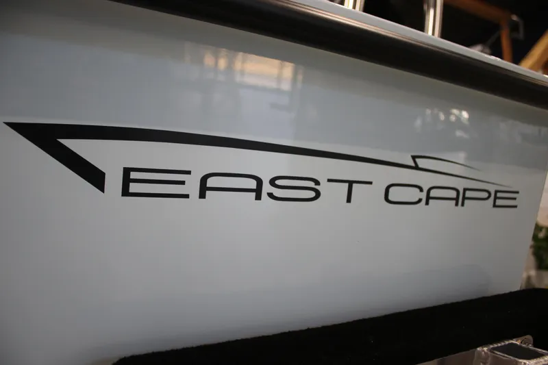 Slide: The Image of 2025 East Cape EVO 18V boat logo on sleek white hull. - 4