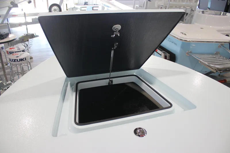 Slide: The Image of Open storage compartment on 2025 East Cape EVO 18V boat. - 6