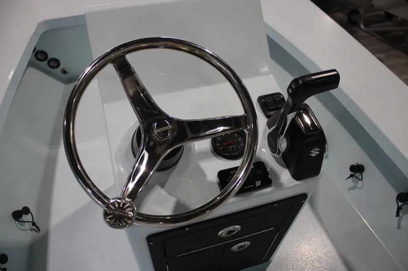 Slide: The Image of 2025 East Cape EVO 18V boat console with steering wheel and controls. - 7