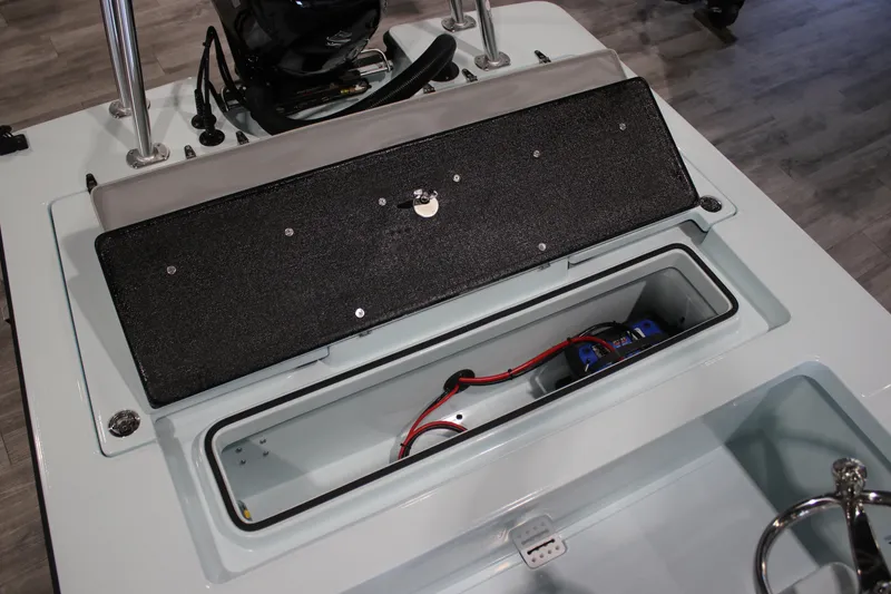 Slide: The Image of 2025 East Cape EVO 18V boat storage compartment with wiring and battery setup. - 9