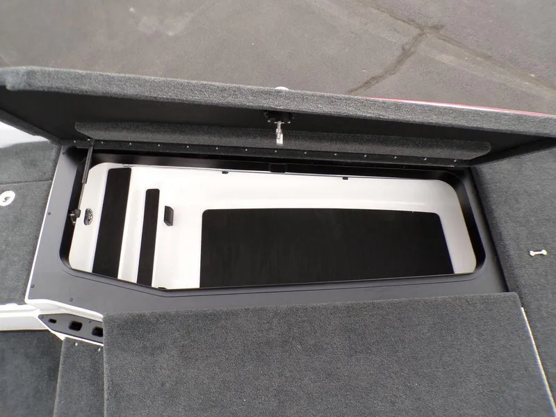 Slide: The Image of Storage compartment of 2025 Skeeter ZXR21SE boat, featuring spacious interior and secure latch. - 14