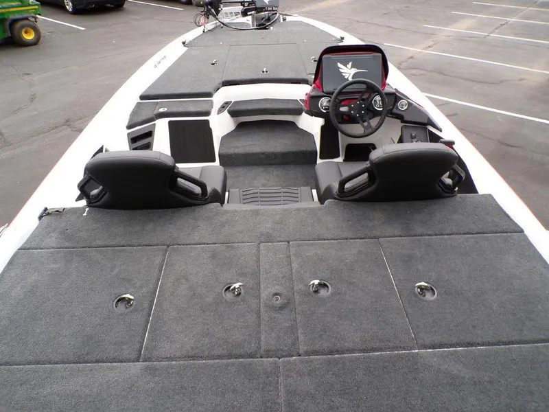 Slide: The Image of 2025 Skeeter ZXR21SE boat interior with dual seats and spacious deck layout. - 18