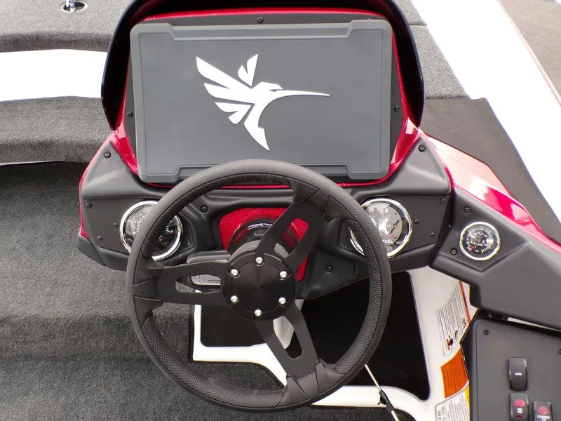 Slide: The Image of 2025 Skeeter ZXR21SE boat dashboard with steering wheel and control panel. - 19
