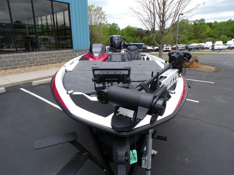 Slide: The Image of 2025 Skeeter ZXR21SE boat parked outdoors, showcasing sleek design and advanced features. - 2