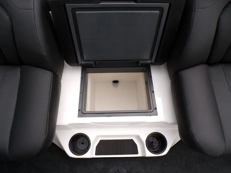 Slide: The Image of 2025 Skeeter ZXR21SE boat interior with open storage compartment between seats. - 22