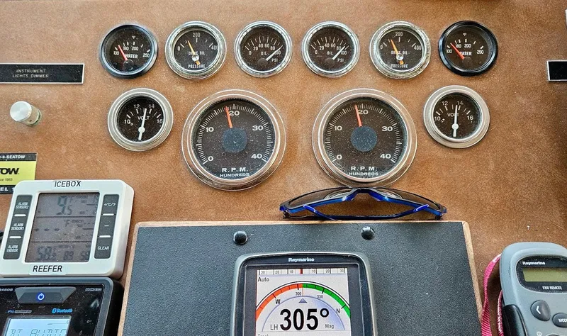 Slide: The Image of Dashboard of a 1976 Hatteras 48 LRC with gauges and navigation instruments. - 18