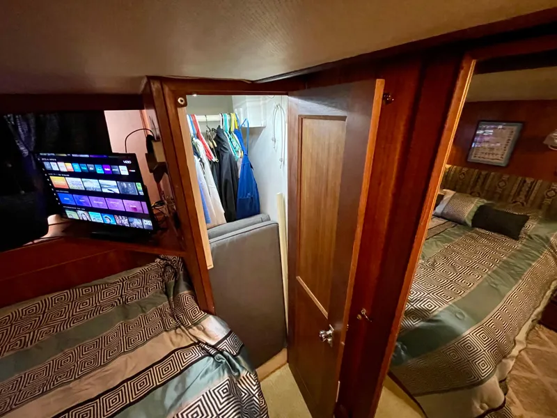 Slide: The Image of Interior of 1976 Hatteras 48 LRC yacht with cozy bedroom and closet space. - 30