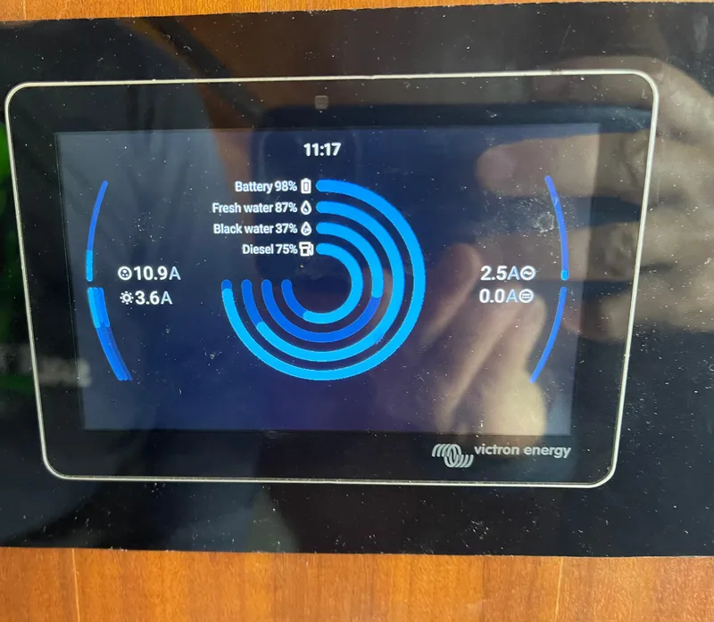 Slide: The Image of Display screen on 1976 Hatteras 48 LRC showing battery and water levels. - 43