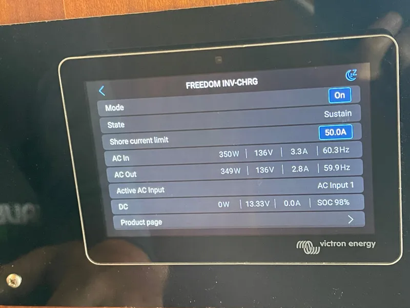 Slide: The Image of Control panel display on a 1976 Hatteras 48 LRC, showing power and charging status. - 44