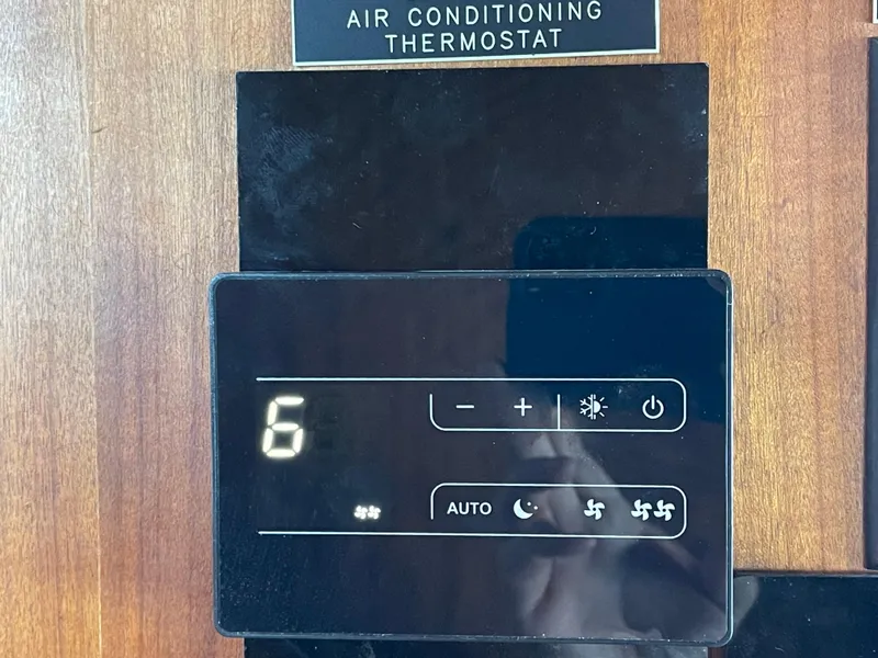 Slide: The Image of Air conditioning thermostat on 1976 Hatteras 48 LRC yacht, displaying settings and controls. - 45