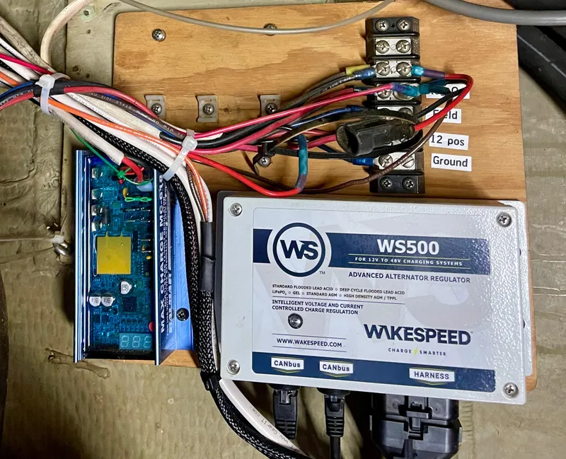 Slide: The Image of 1976 Hatteras 48 LRC electrical system with Wakespeed WS500 alternator regulator. - 48