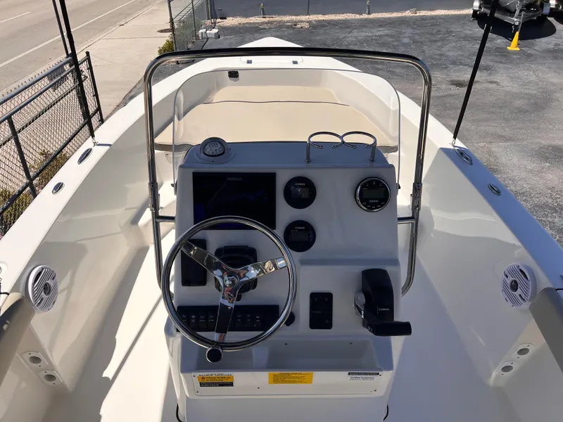 Slide: The Image of 2025 Key West 179 FS boat console with steering wheel and gauges. - 20