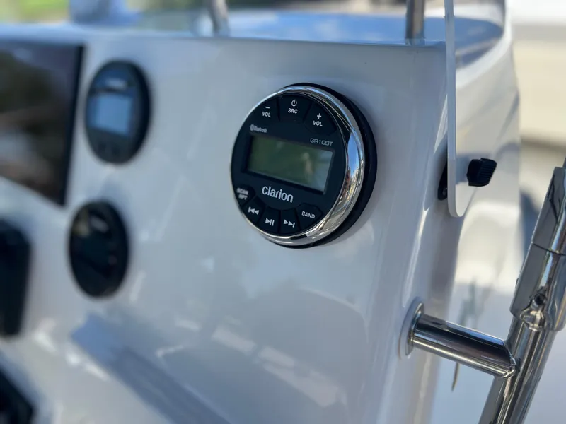 Slide: The Image of Control panel of 2025 Key West 179 FS boat featuring Clarion audio system. - 21