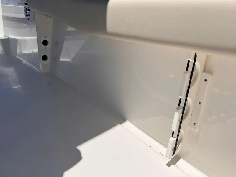 Slide: The Image of Interior view of 2025 Key West 179 FS boat, showcasing sleek white finish and seating area. - 25