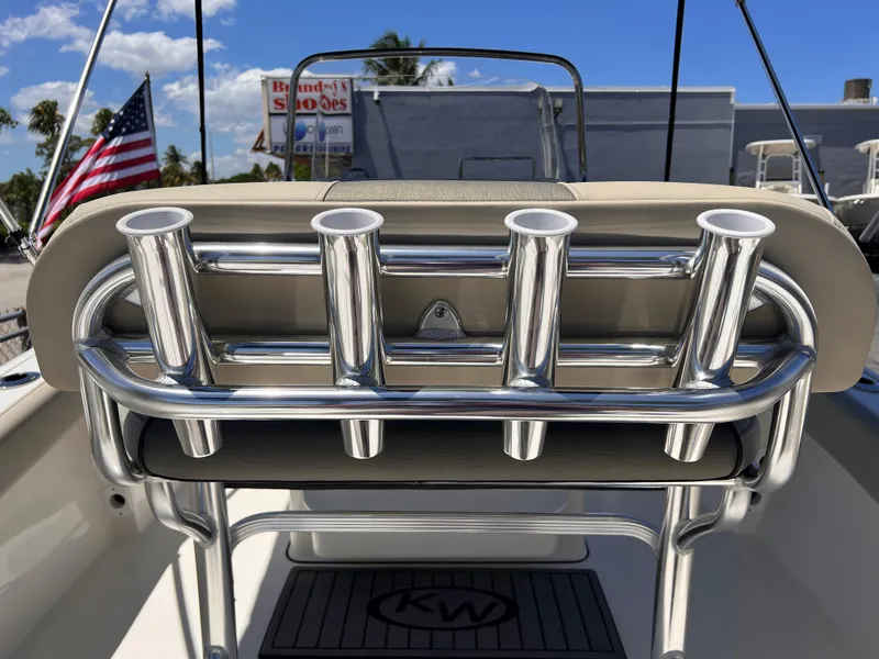 Slide: The Image of 2025 Key West 179 FS boat with rod holders and American flag in the background. - 26