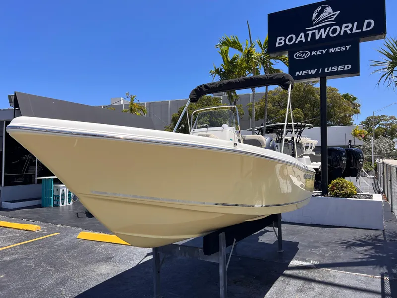 Slide: The Image of 2025 Key West 179 FS boat displayed at Boatworld dealership under clear blue sky. - 3
