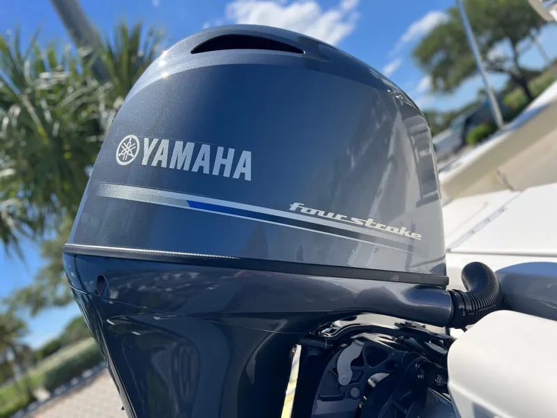 Slide: The Image of Yamaha four-stroke engine on 2025 Key West 179 FS boat, sunny day background. - 6