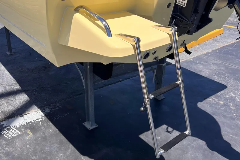Slide: The Image of 2025 Key West 179 FS boat with a foldable ladder on the stern. - 8