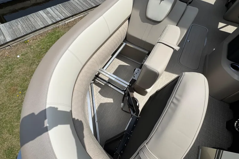 Slide: The Image of 2025 Tahoe Pontoon LTZ Quad Lounger Shift interior with beige seating and metal frame. - 15