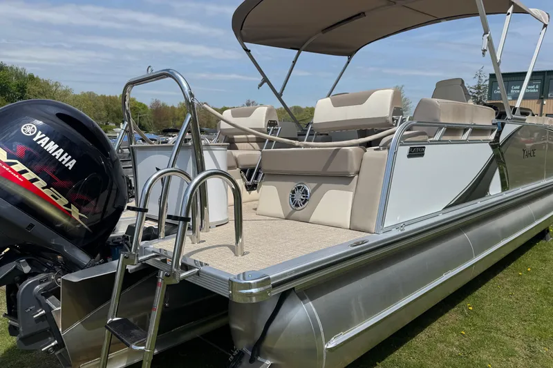 Slide: The Image of 2025 Tahoe Pontoon LTZ Quad Lounger Shift with Yamaha engine, featuring spacious seating and canopy. - 2
