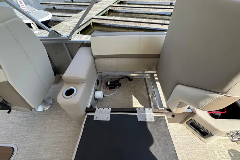 Slide: The Image of 2025 Tahoe Pontoon LTZ Quad Lounger Shift interior seating and storage view. - 8