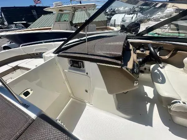 Slide: The Image of 2014 Chaparral 307 SSX boat interior with steering wheel and dashboard. - 14