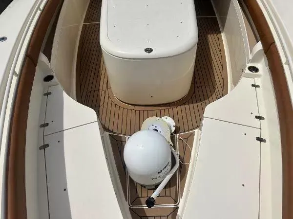 Slide: The Image of 2018 Scout 350 LXF boat deck with wooden flooring and equipment. - 23