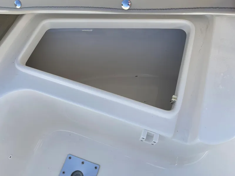 Slide: The Image of Open storage compartment on a 2025 Key West 219 FS boat. - 11