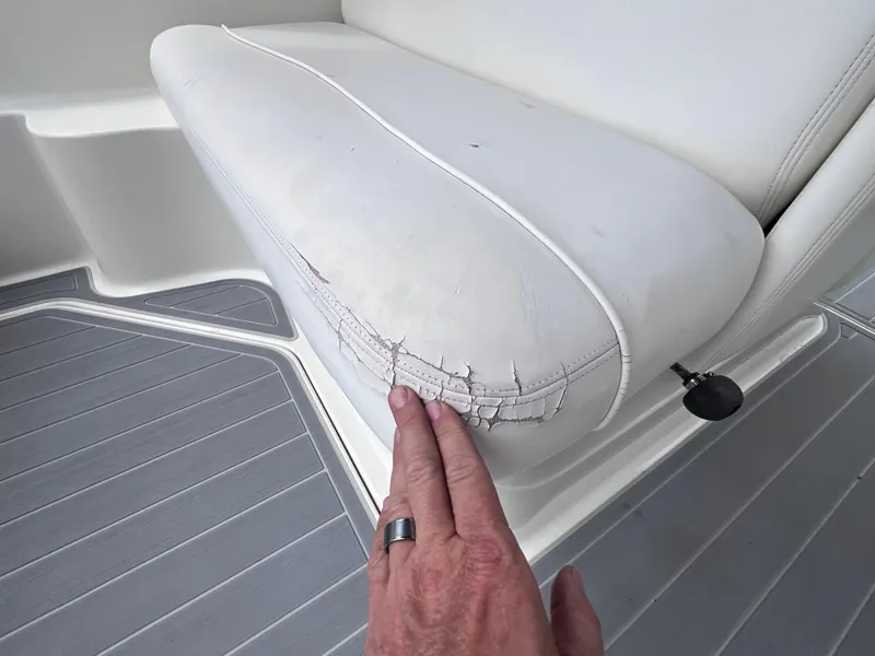 Slide: The Image of Cracked seat upholstery on 2004 Sea Ray 260 Sundancer boat. - 12