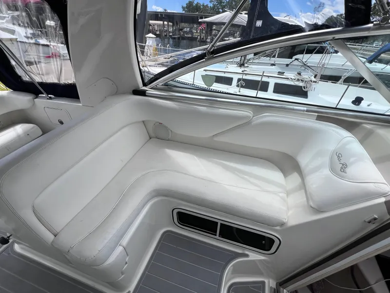 Slide: The Image of Interior of 2004 Sea Ray 260 Sundancer with white leather seating. - 14
