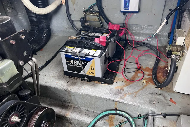 Slide: The Image of Battery compartment of a 2004 Sea Ray 260 Sundancer with AGM battery and wiring. - 31