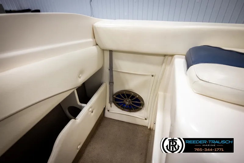 Slide: The Image of 2002 Rinker 180 boat interior with speaker and storage compartments. - 20