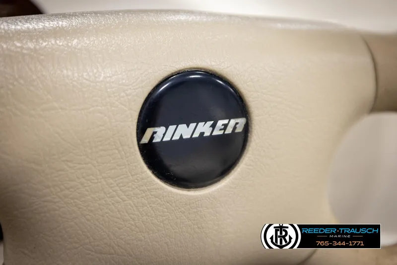 Slide: The Image of Close-up of 2002 Rinker 180 steering wheel with logo. - 23