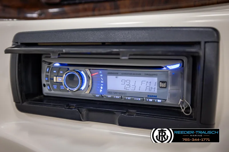 Slide: The Image of Marine stereo system in a 2002 Rinker 180 boat dashboard. - 30