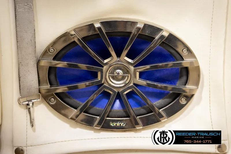 Slide: The Image of Speaker with metallic grille on a 2002 Rinker 180 boat interior. - 31