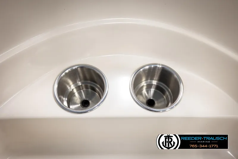 Slide: The Image of Cup holders on a 2002 Rinker 180 boat, featuring stainless steel design. - 32