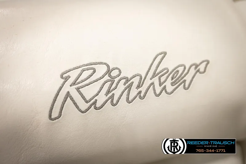 Slide: The Image of Rinker 180 boat logo on white upholstery, 2002 model, Reeder-Trausch Marine branding. - 35