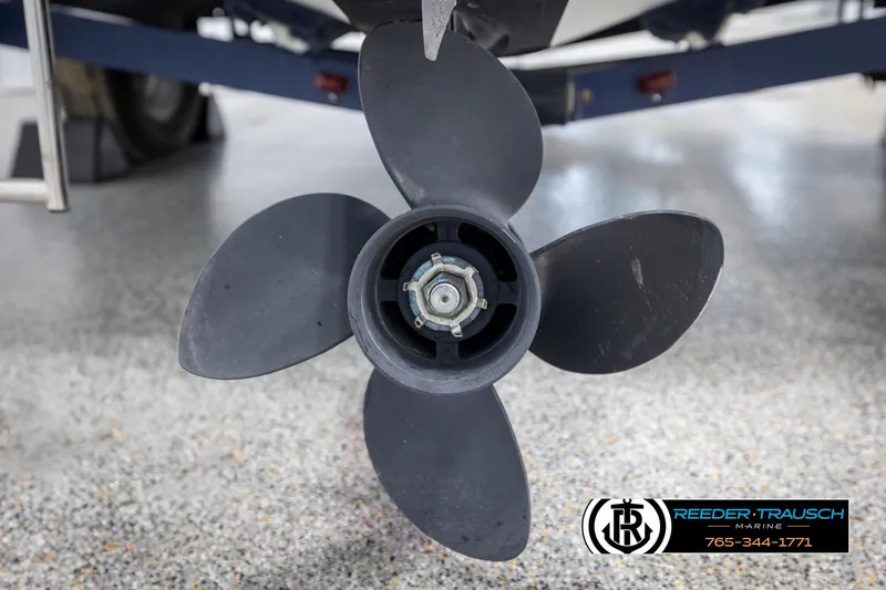 Slide: The Image of Propeller of a 2002 Rinker 180 boat on display in a showroom. - 40