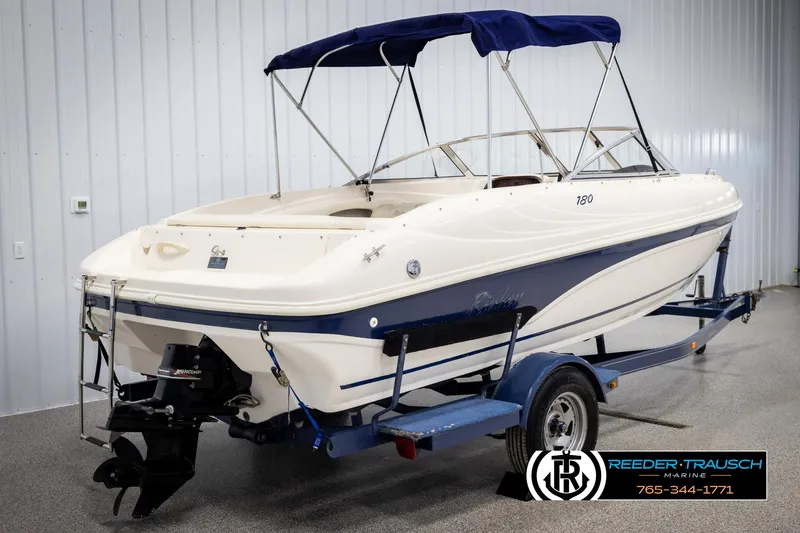 Slide: The Image of 2002 Rinker 180 boat on trailer in indoor showroom. - 5
