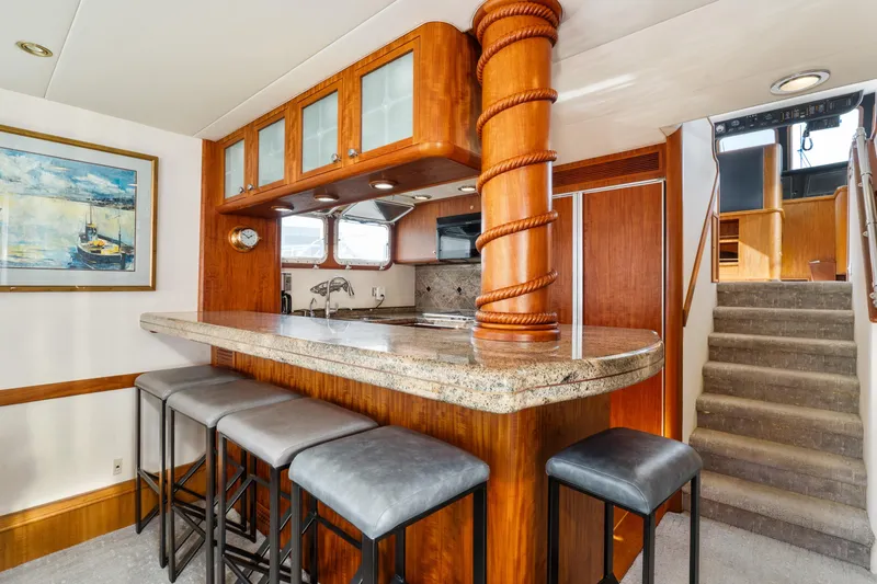 Slide: The Image of Luxurious 1998 Northern Marine Trawler interior with elegant bar and seating area. - 13