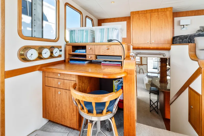 Slide: The Image of 1998 Northern Marine Trawler interior with wooden desk, chair, and nautical instruments. - 20