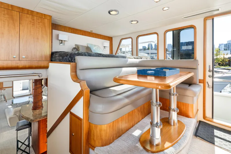 Slide: The Image of Luxurious interior of a 1998 Northern Marine Trawler with dining area and modern furnishings. - 21