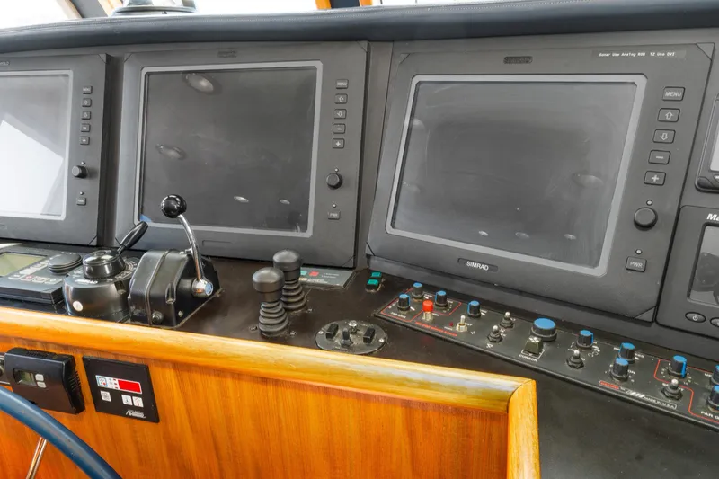 Slide: The Image of 1998 Northern Marine Trawler control panel with navigation screens and controls. - 27