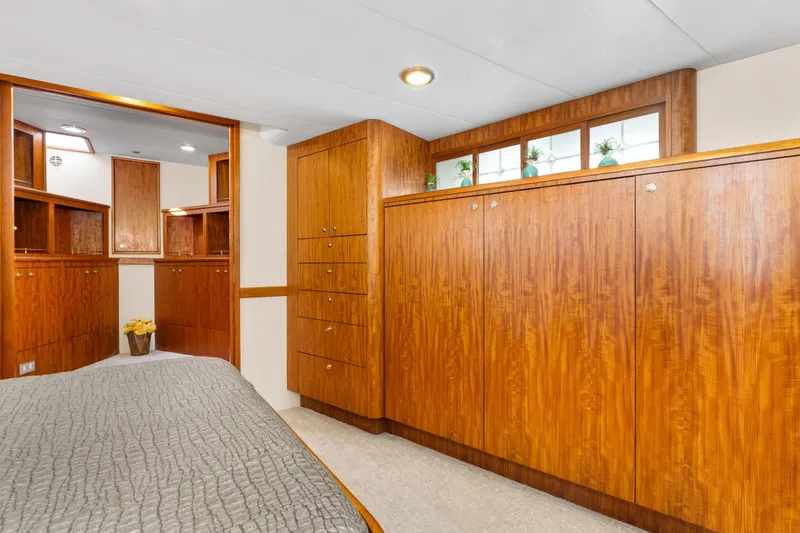 Slide: The Image of Luxurious wood-paneled interior of a 1998 Northern Marine Trawler yacht bedroom. - 29
