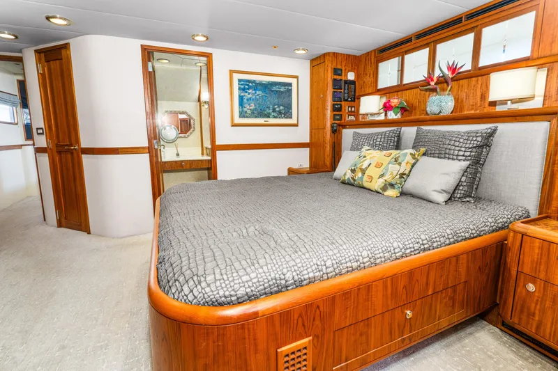 Slide: The Image of Luxurious 1998 Northern Marine Trawler bedroom with elegant wood finishes and modern decor. - 31
