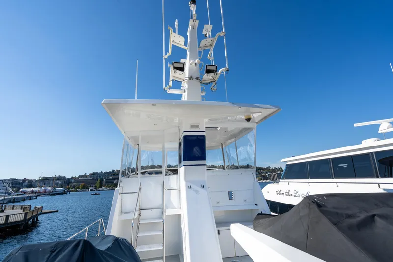 Slide: The Image of 1998 Northern Marine Trawler docked at marina under clear blue sky. - 39