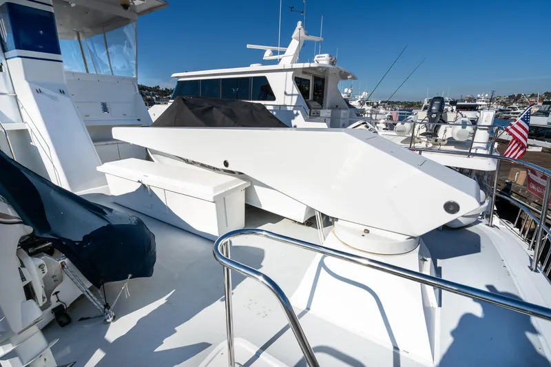 Slide: The Image of 1998 Northern Marine Trawler yacht deck with seating and equipment, docked at marina. - 40